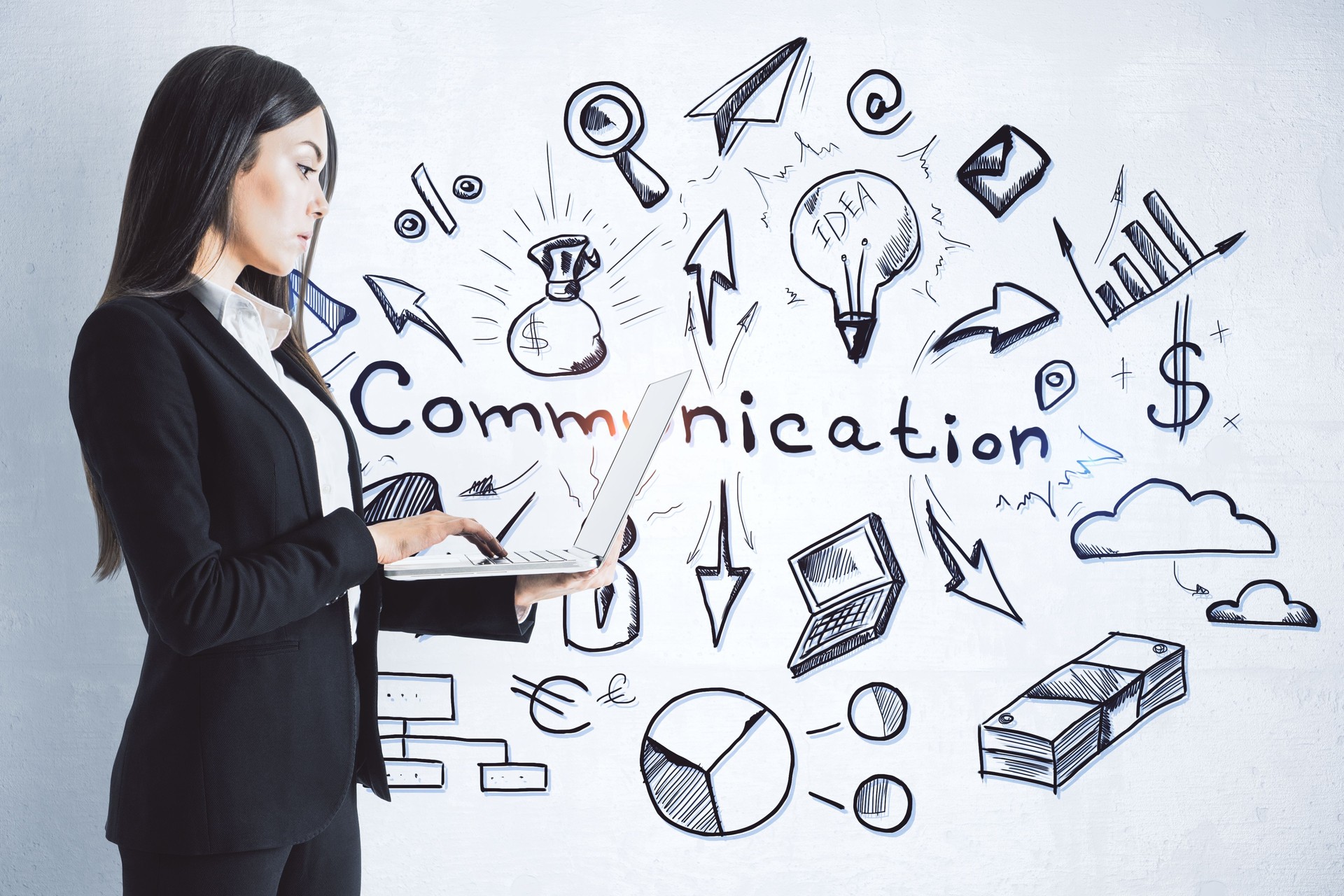 Businesswoman using laptop and drawing communication business sketch